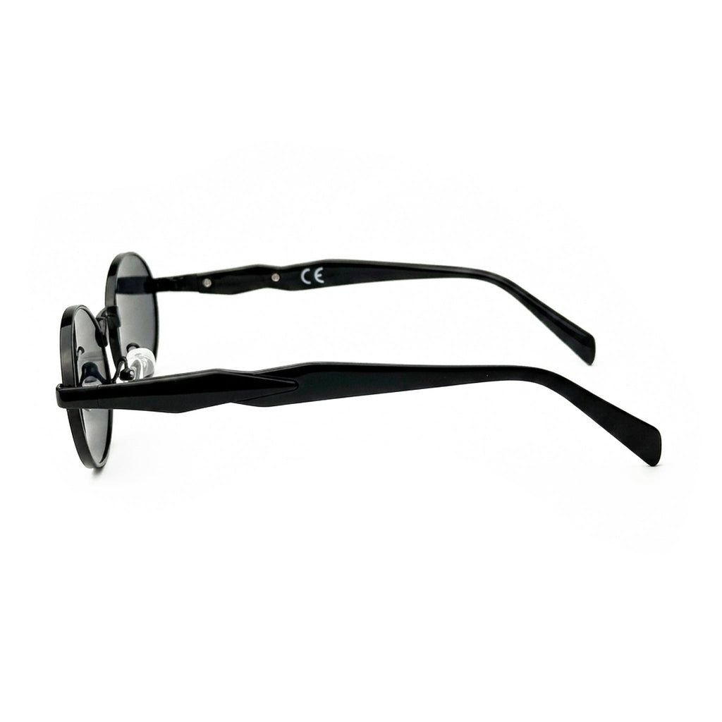 Side view of round black sunglasses with dark lenses on white background