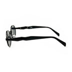 Side view of round black sunglasses with dark lenses on white background