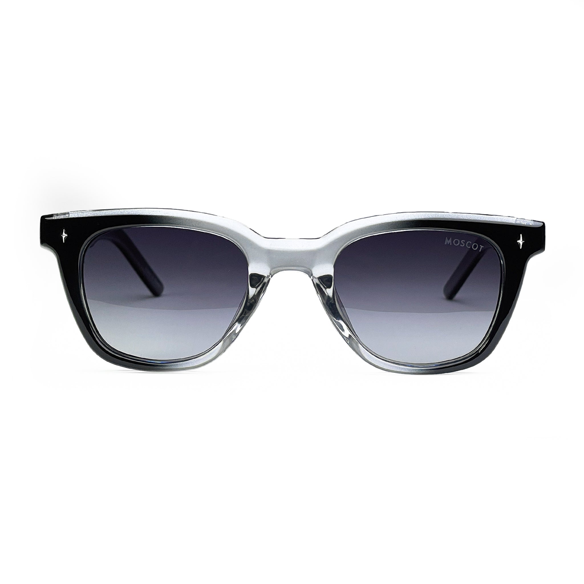 Black and clear acetate square sunglasses with gradient lenses on white background