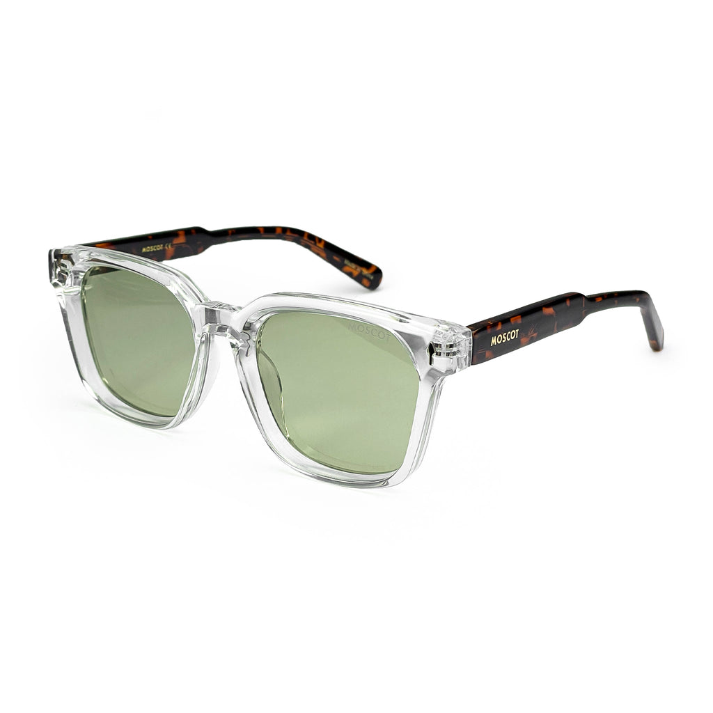 Square clear frame sunglasses with green lenses and tortoiseshell arms on white background