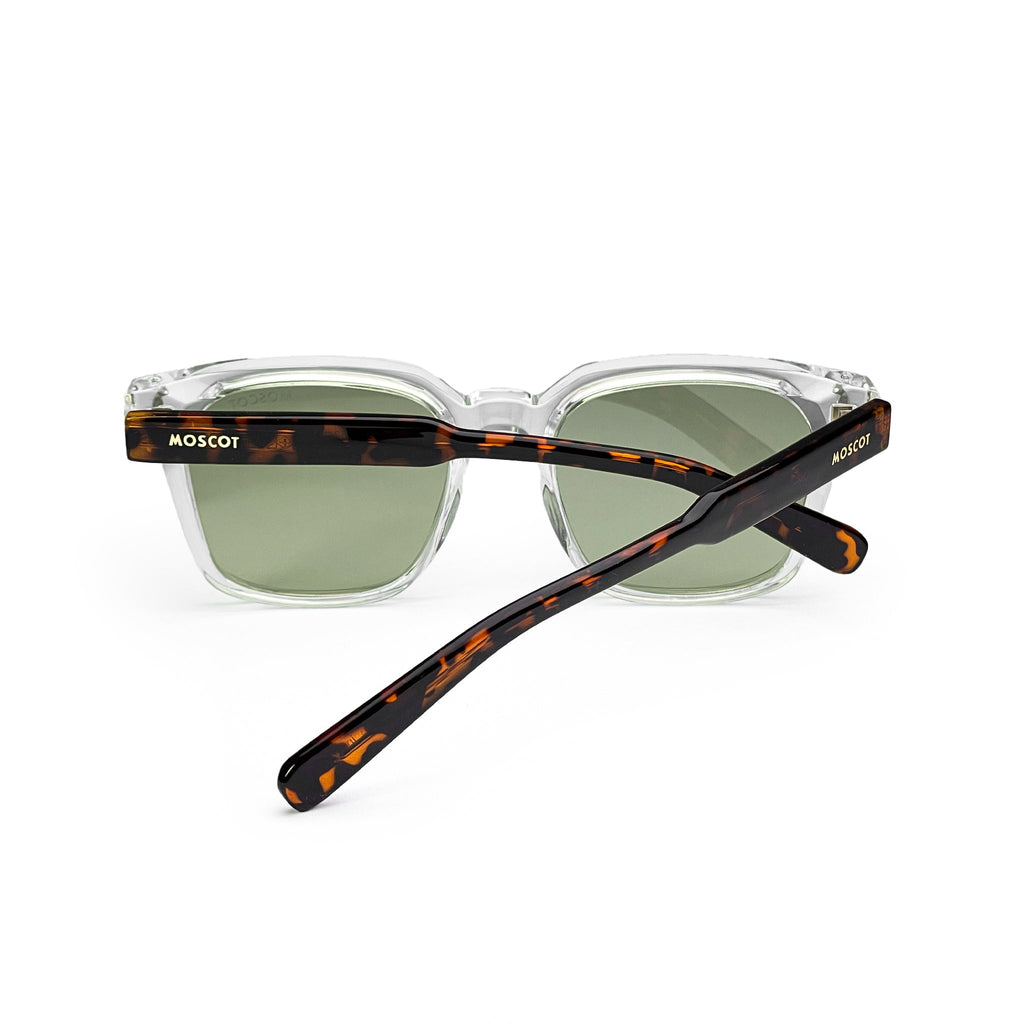 Clear square sunglasses with green lenses and tortoiseshell arms on white background
