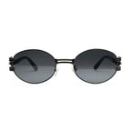 Round black metal sunglasses with dark lenses and unique side hinges on white background