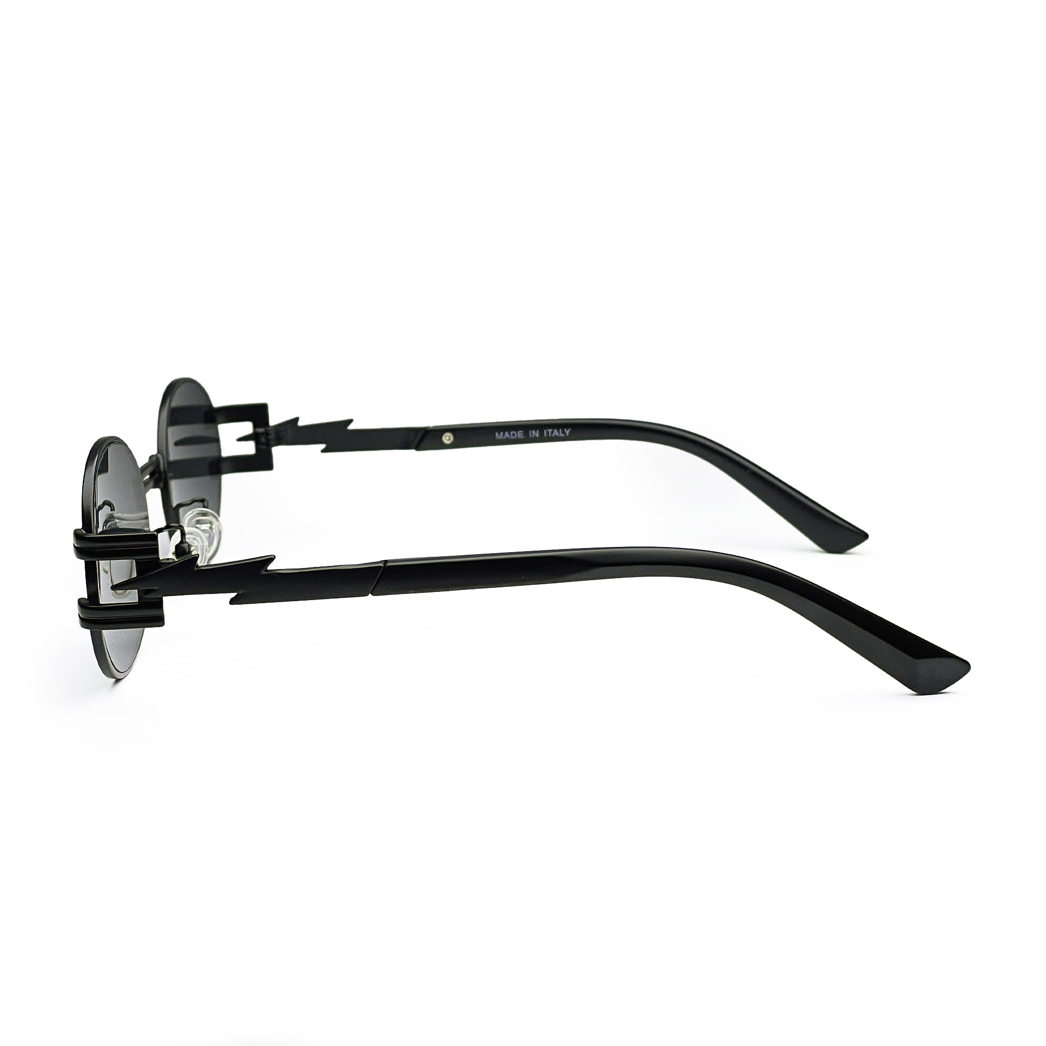 Side view of black sunglasses with zigzag temple arms and round dark lenses on white background