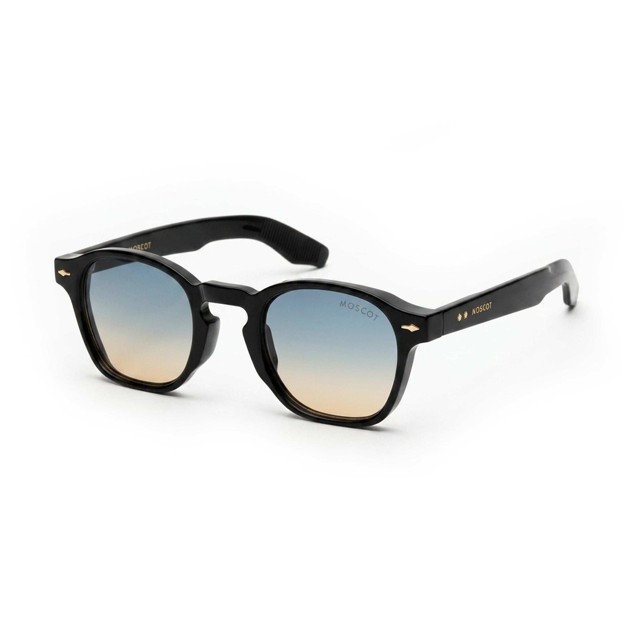 Black acetate sunglasses with gradient blue and brown lenses on a white background
