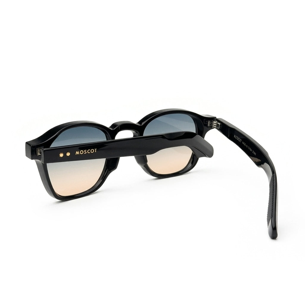 Black round sunglasses with gradient lenses and MOSCOT logo on the arm