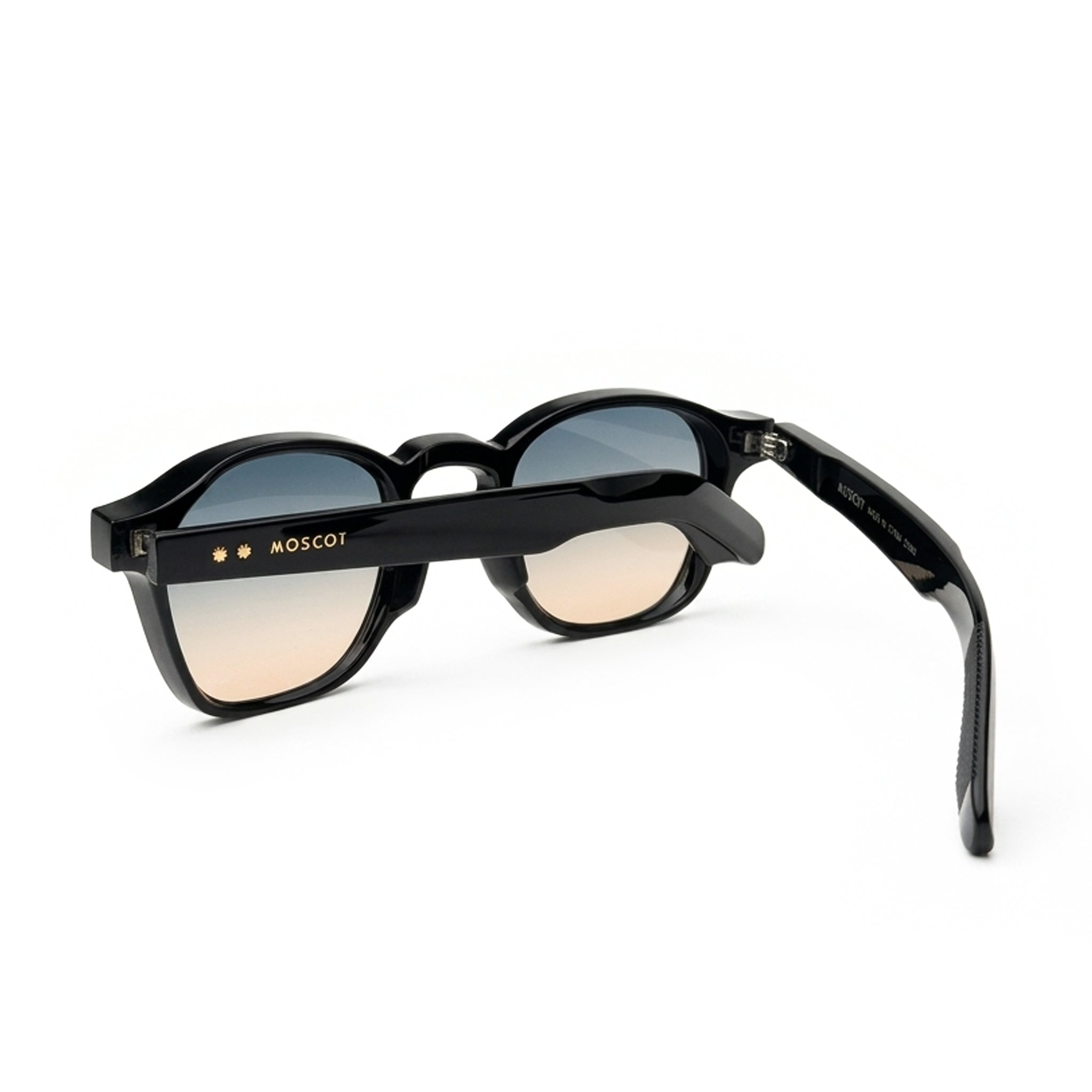 Black round sunglasses with gradient lenses and MOSCOT logo on the arm