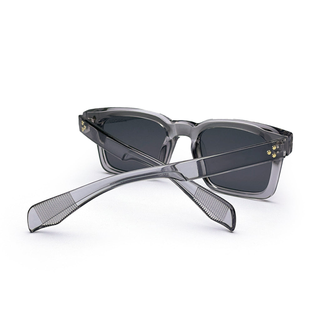 Grey square sunglasses with dark lenses and translucent frames on a white background