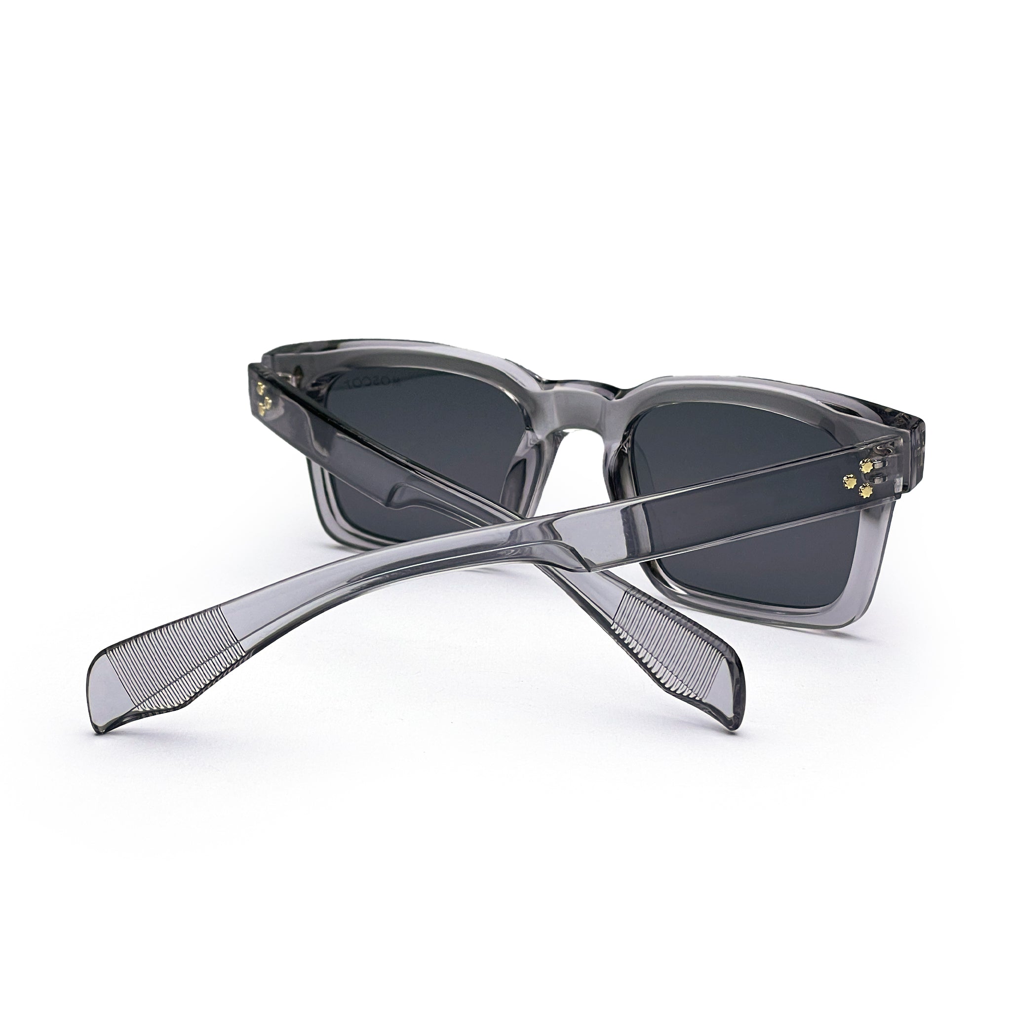 Grey square sunglasses with dark lenses and translucent frames on a white background