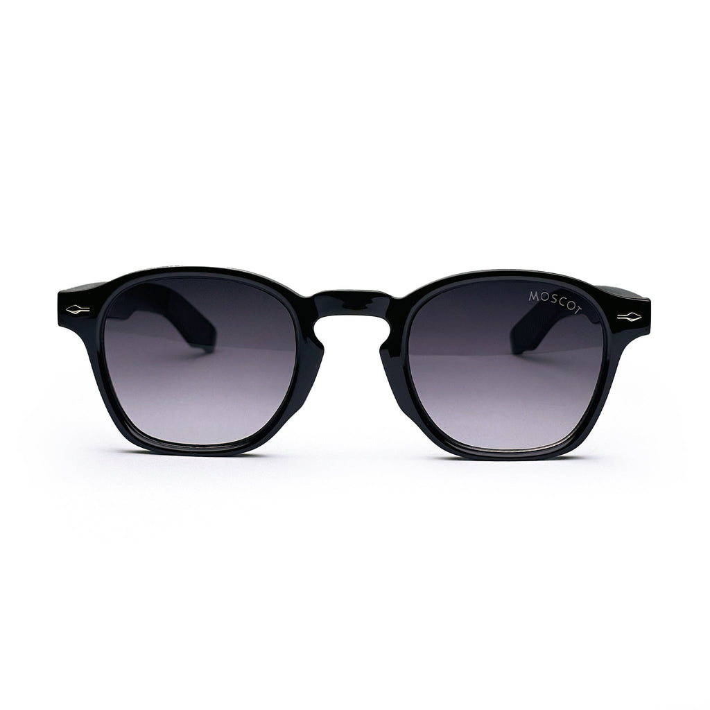 Black round sunglasses with thick frames and dark lenses on white background