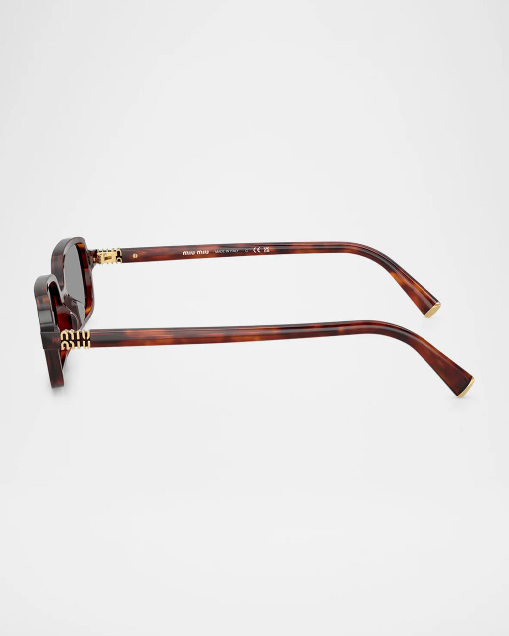 Tortoiseshell rectangular sunglasses with gold accents, side view on white background